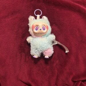 Fluffy Plush Toy with Purple Accents